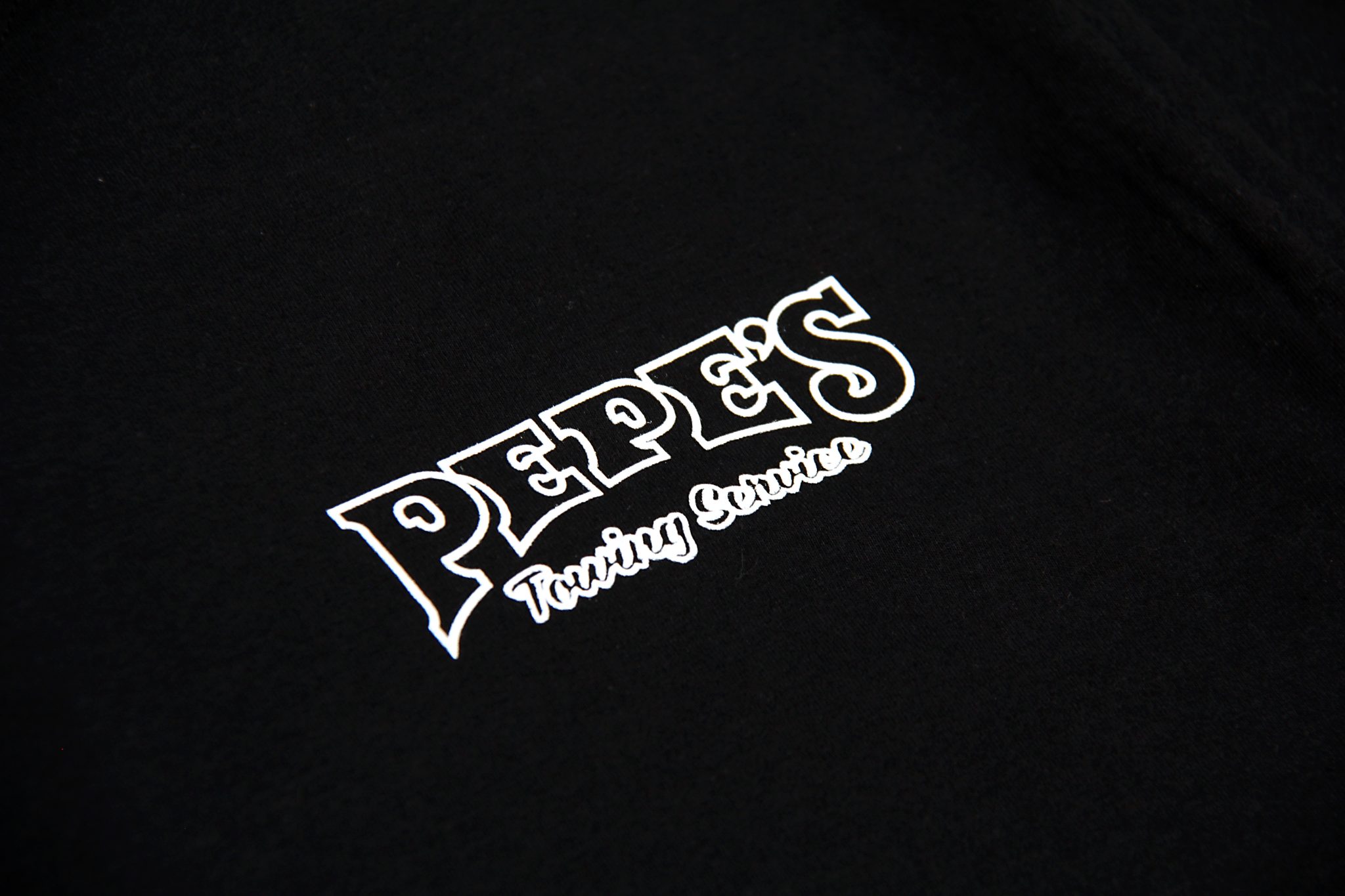 Pepe’s Logo and USA Flag T-Shirt – Black | Pepe's Towing